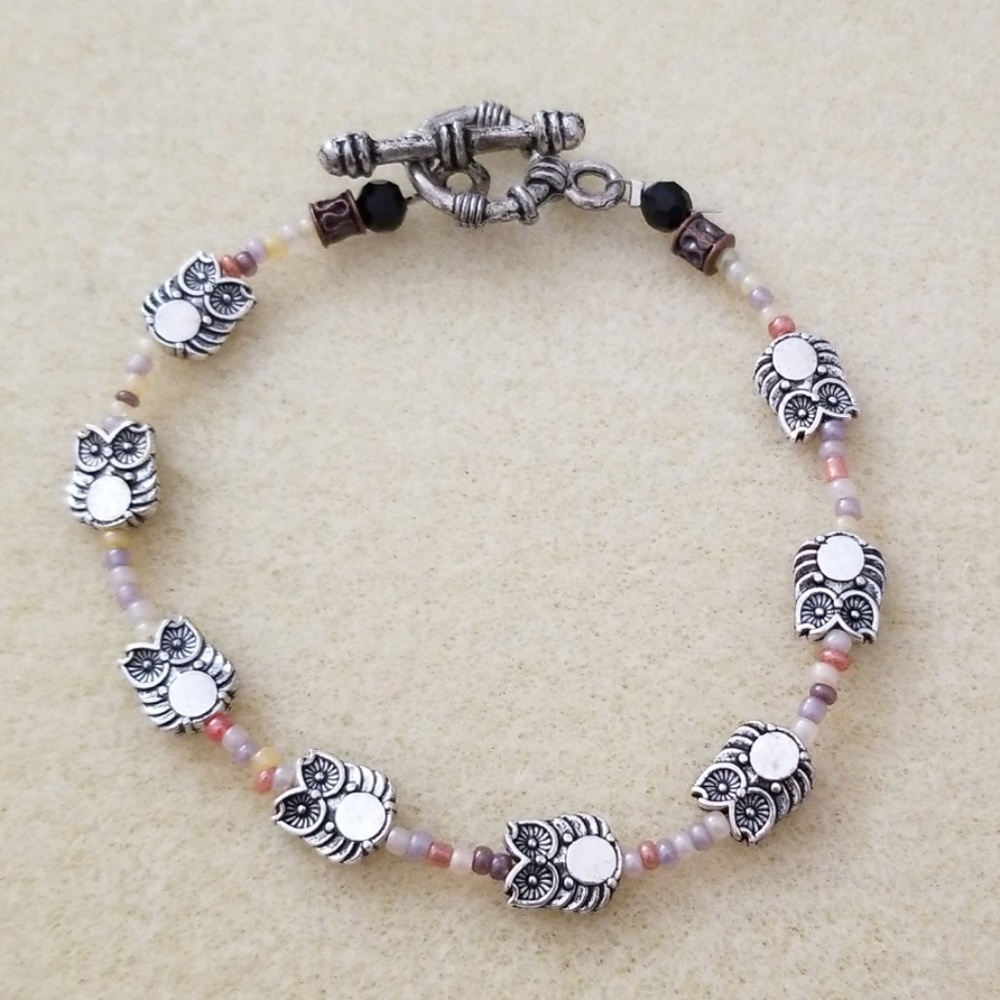 Handmade silver tone owl beaded bracelet.